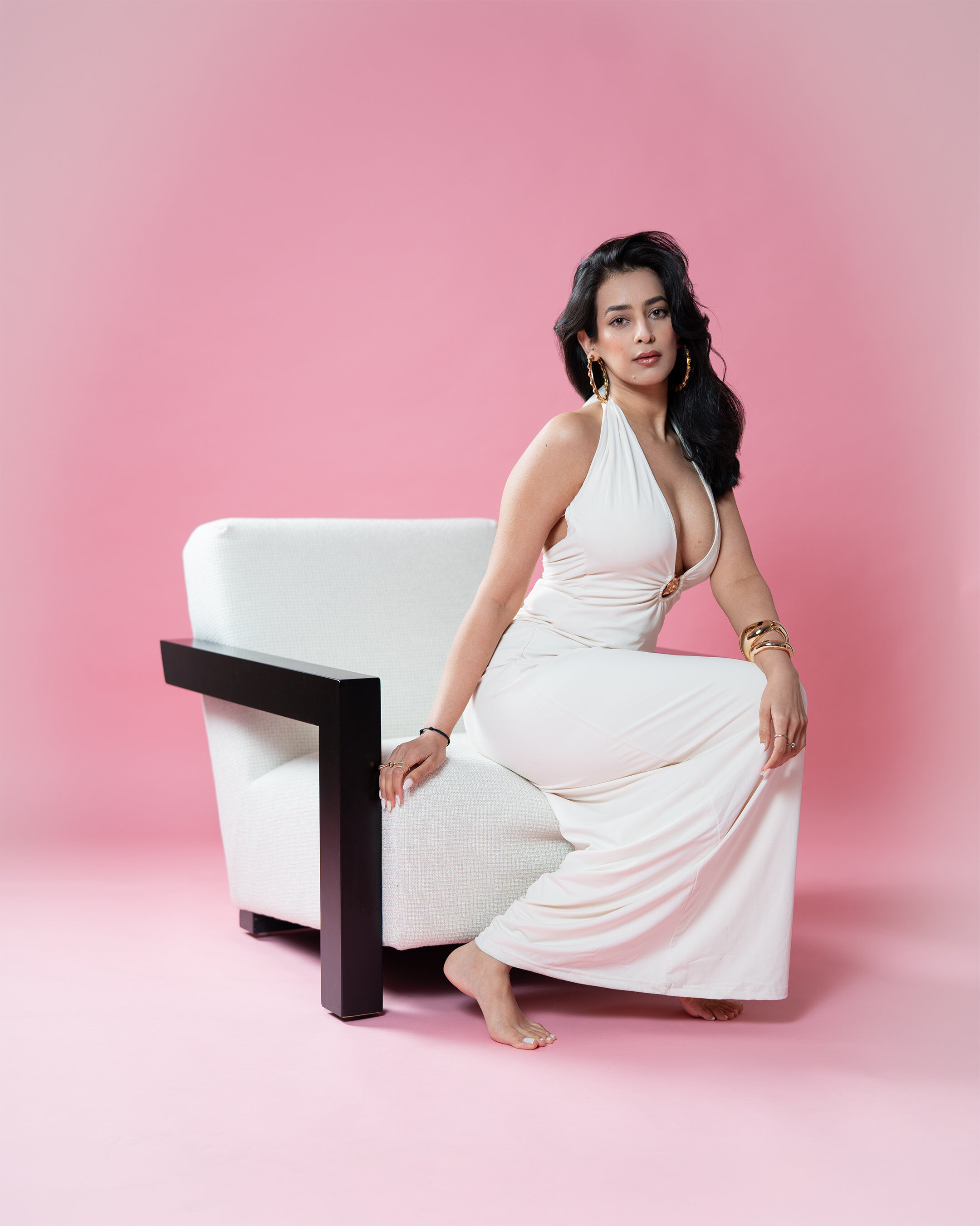 Studio portrait — white dress on pink backdrop