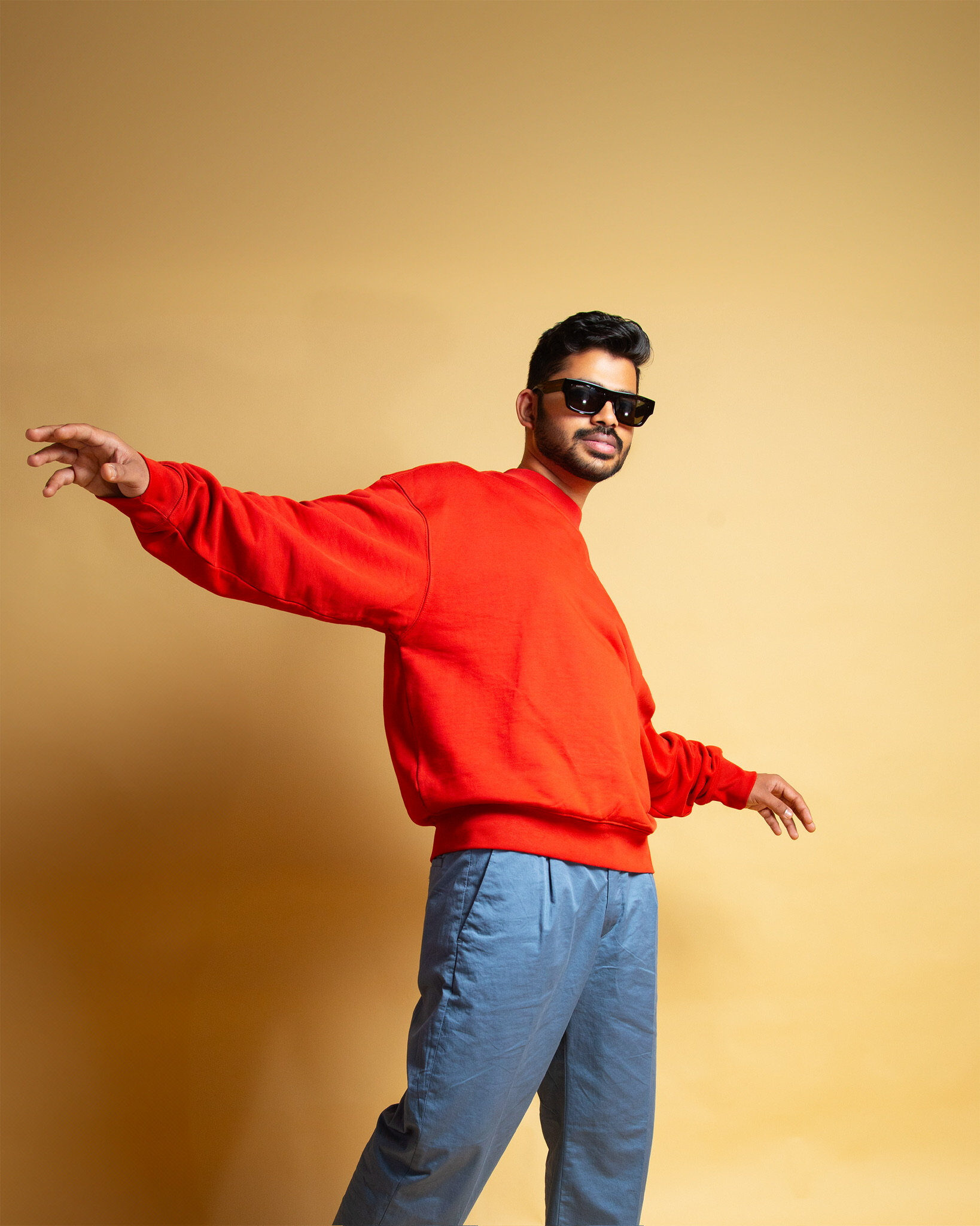 Male studio portrait — dynamic red sweater