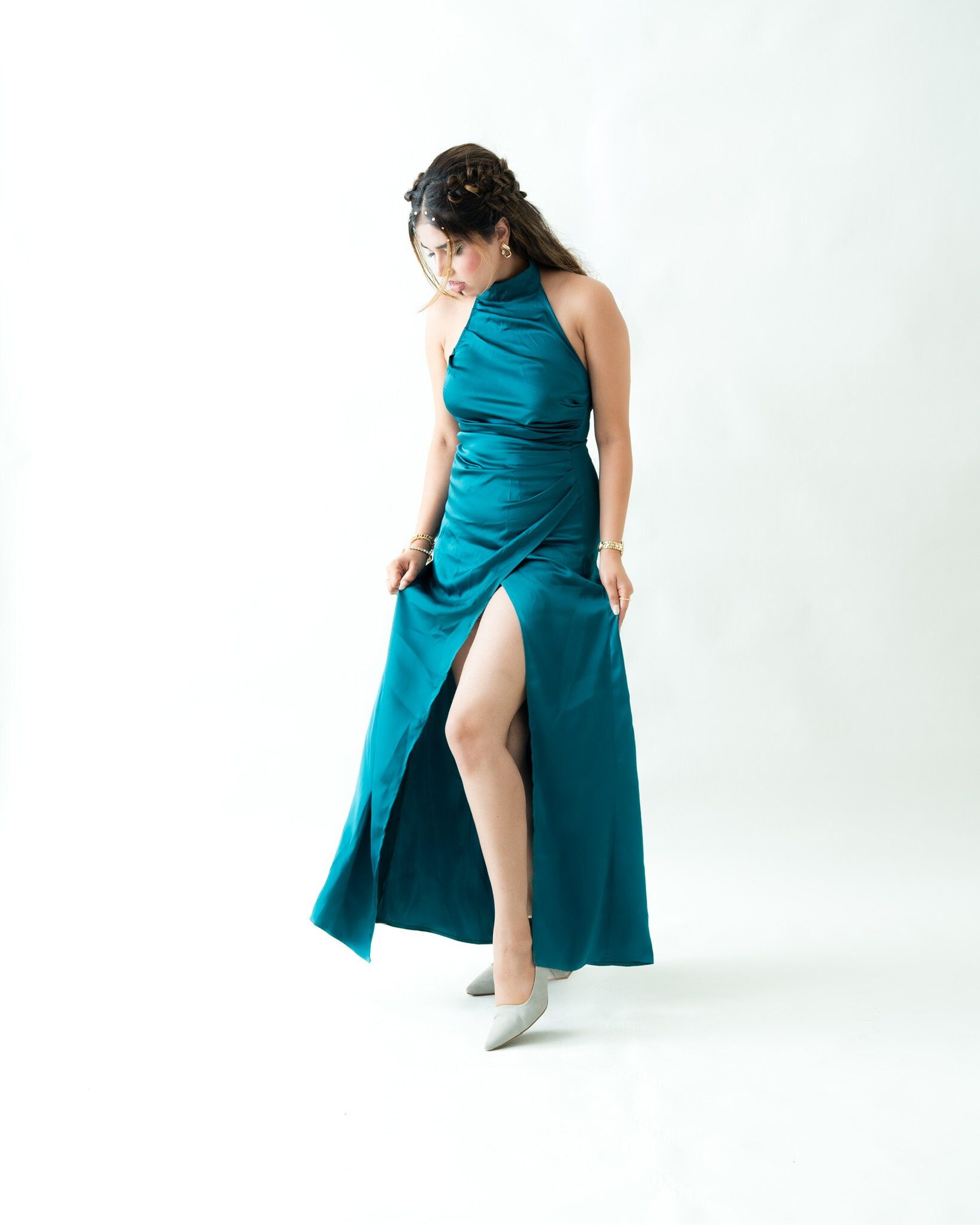 Studio portrait — teal dress white background