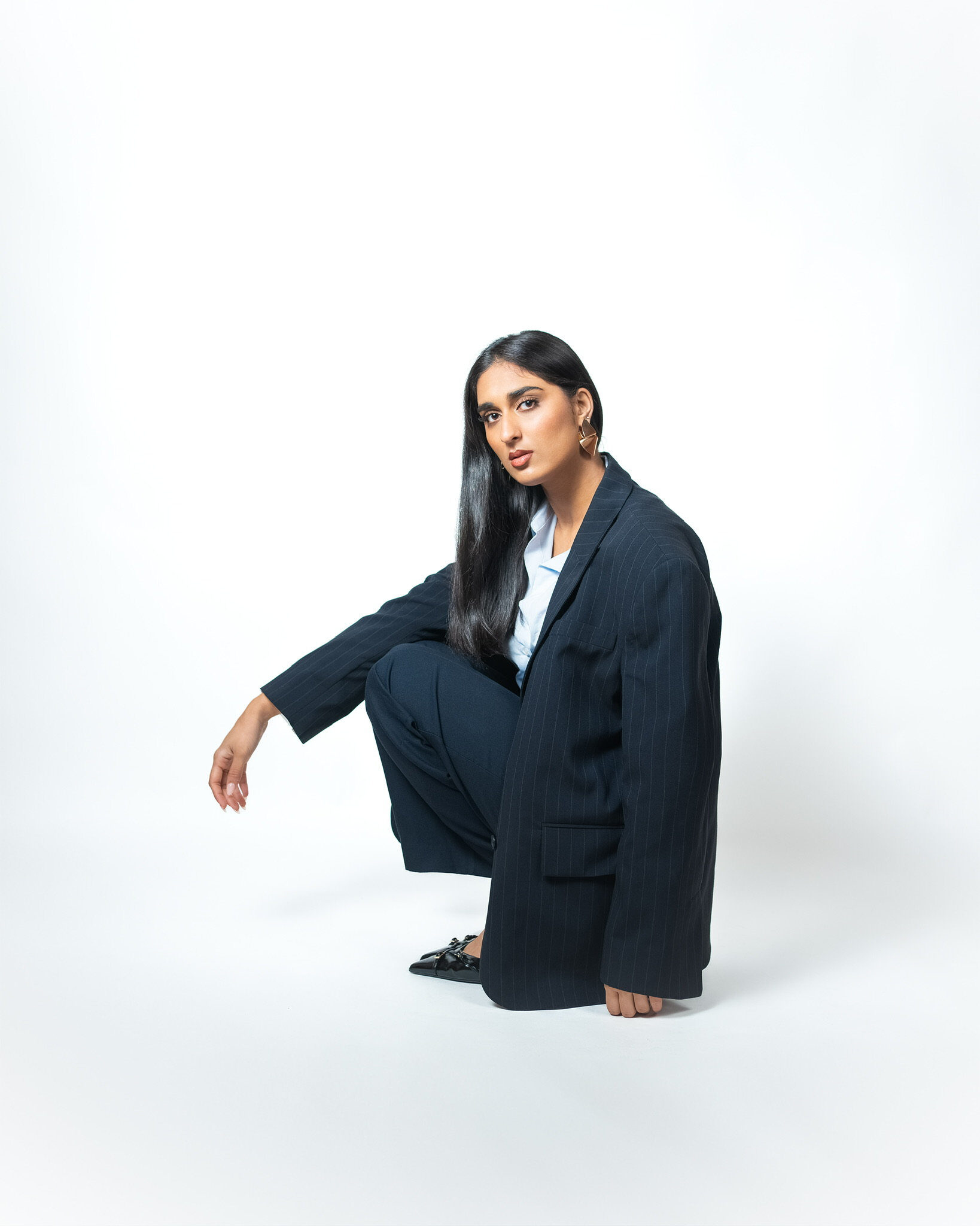 Professional headshot — pinstripe suit