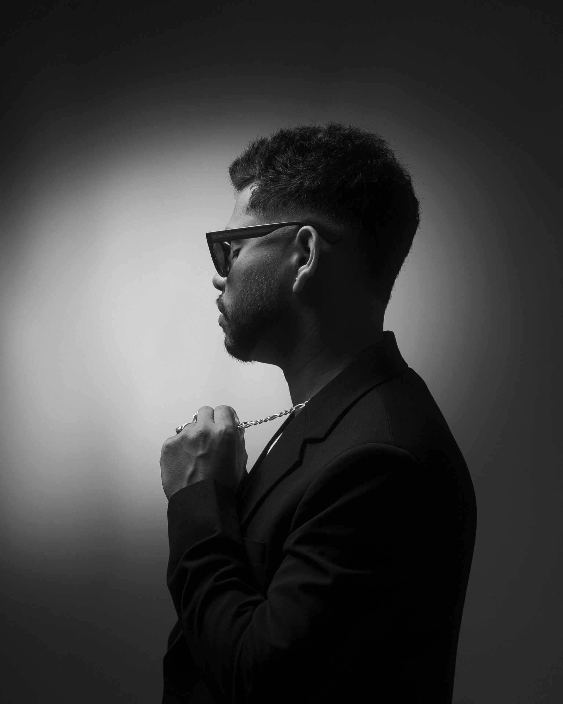 Male portrait — B&W profile sunglasses chain
