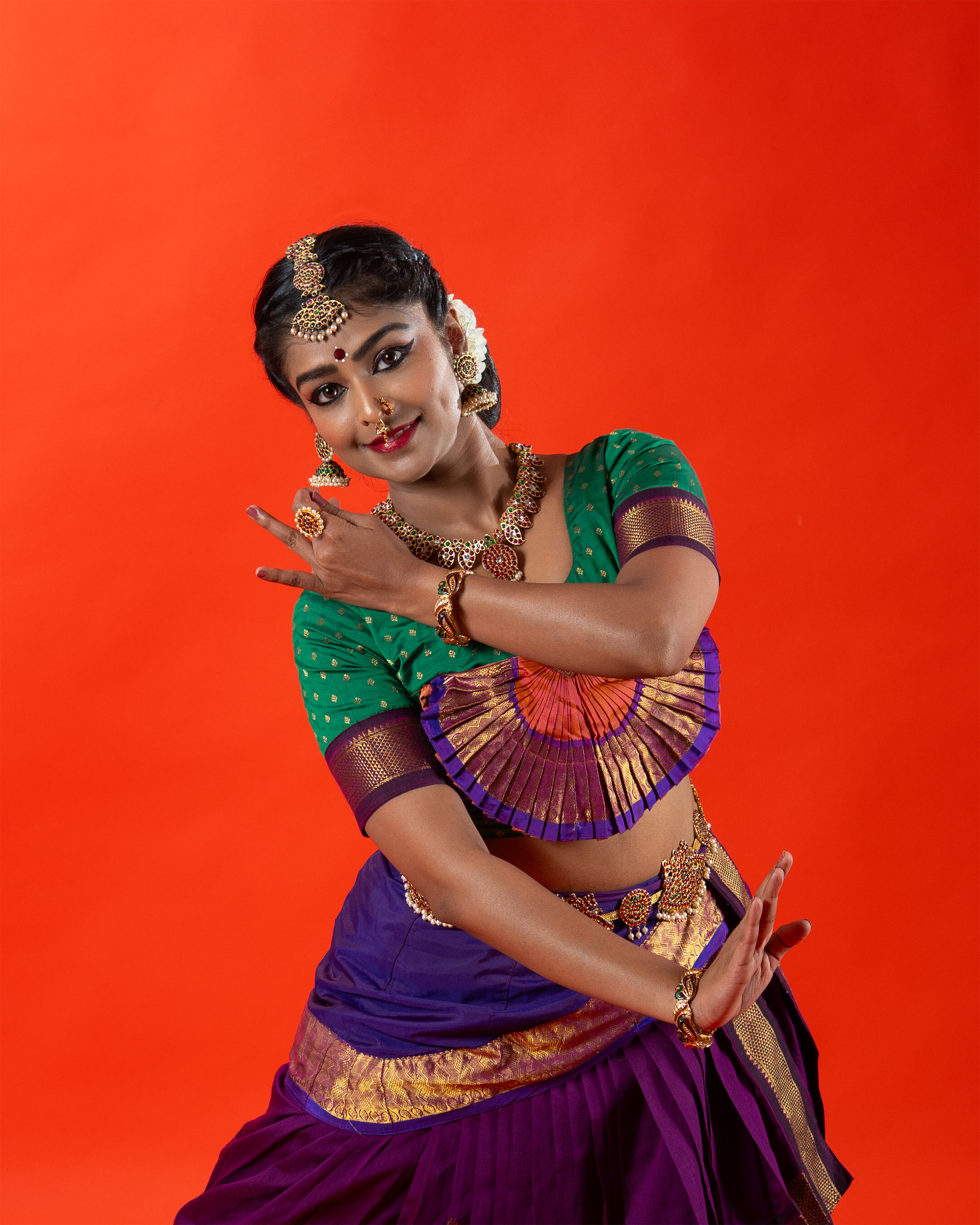 Classical dancer — Bharatanatyam close-up on red