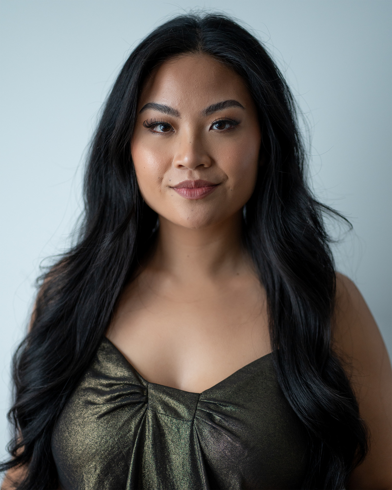 Model headshot — metallic dress direct gaze