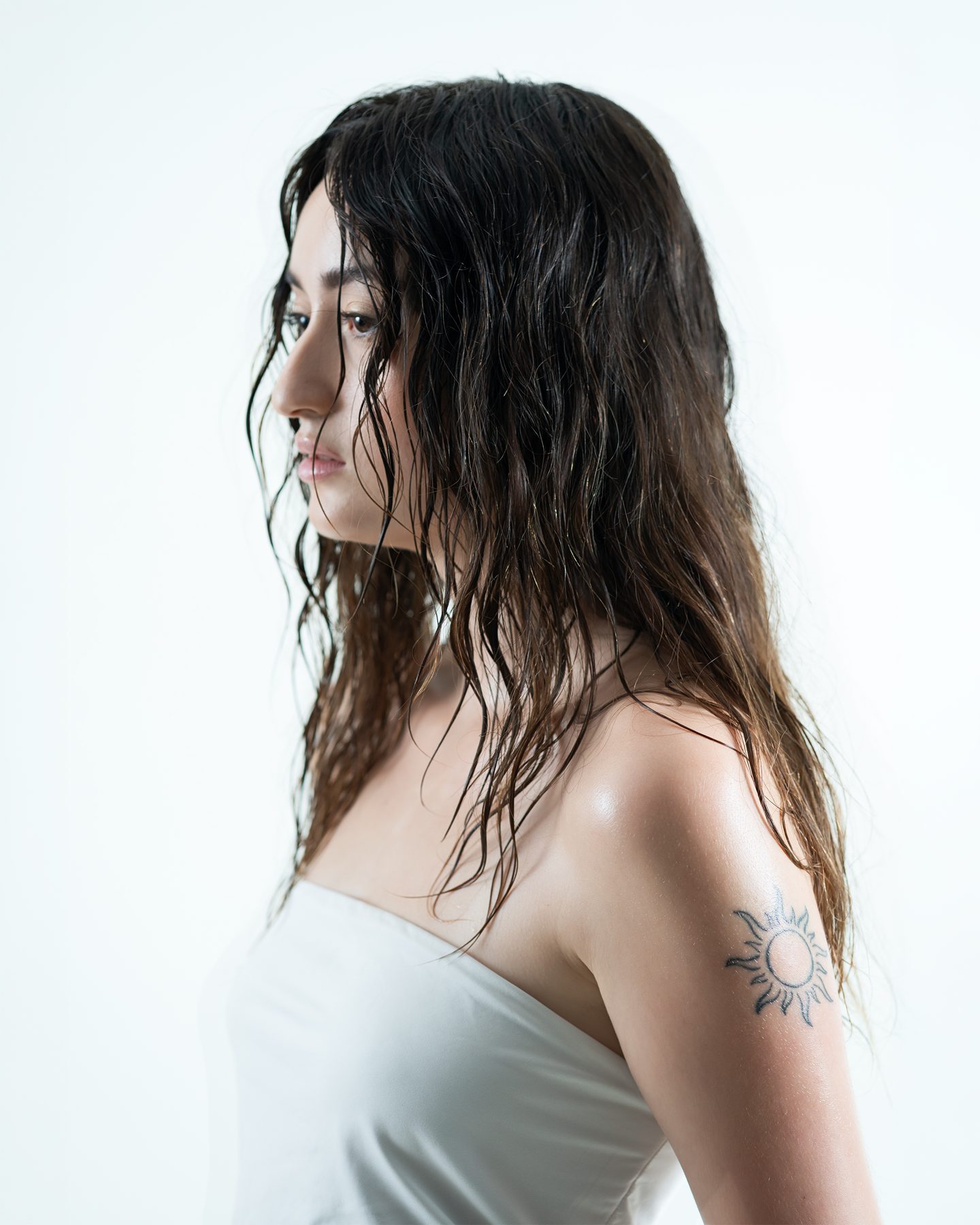 Studio portrait — side profile