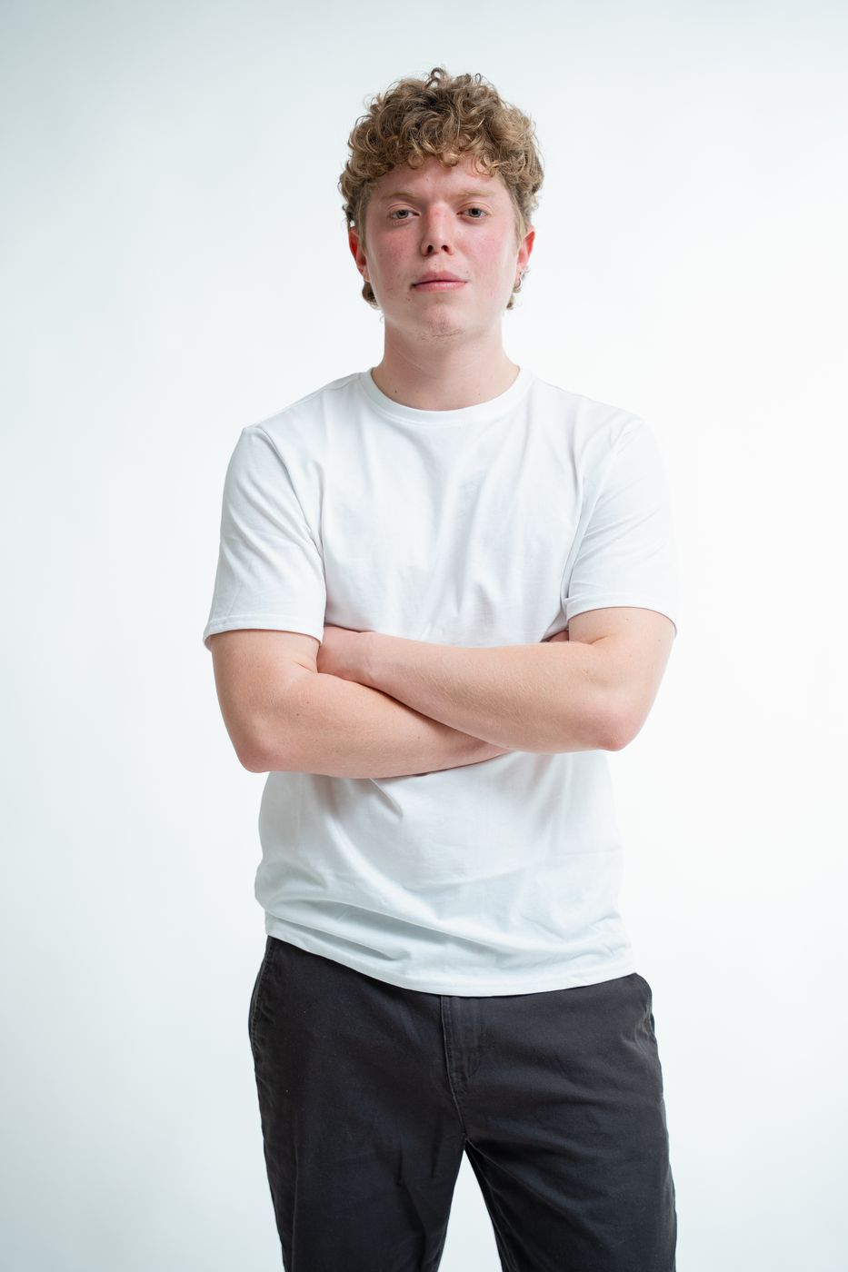 Studio portrait — relaxed, arms crossed, Melbourne studio