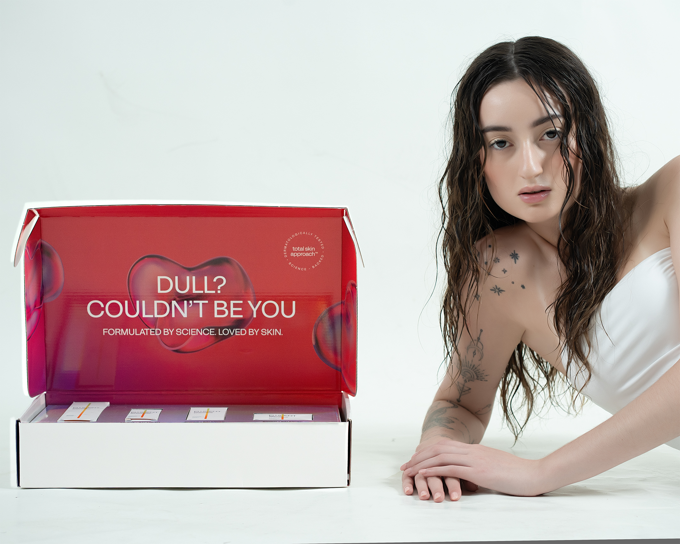 Elucent — red box unboxing reveal, brand campaign editorial