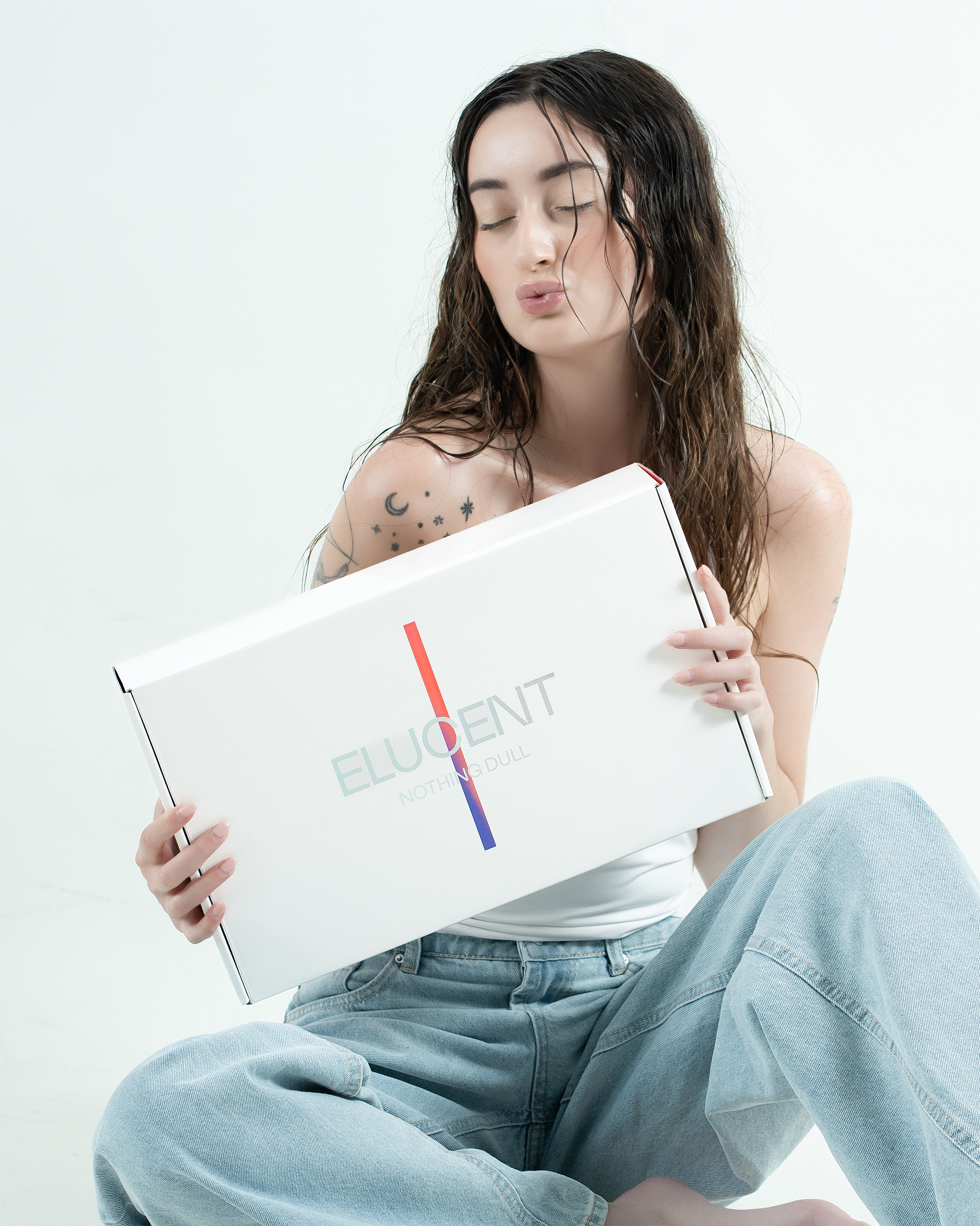 Elucent — lifestyle box campaign, jeans and minimal styling