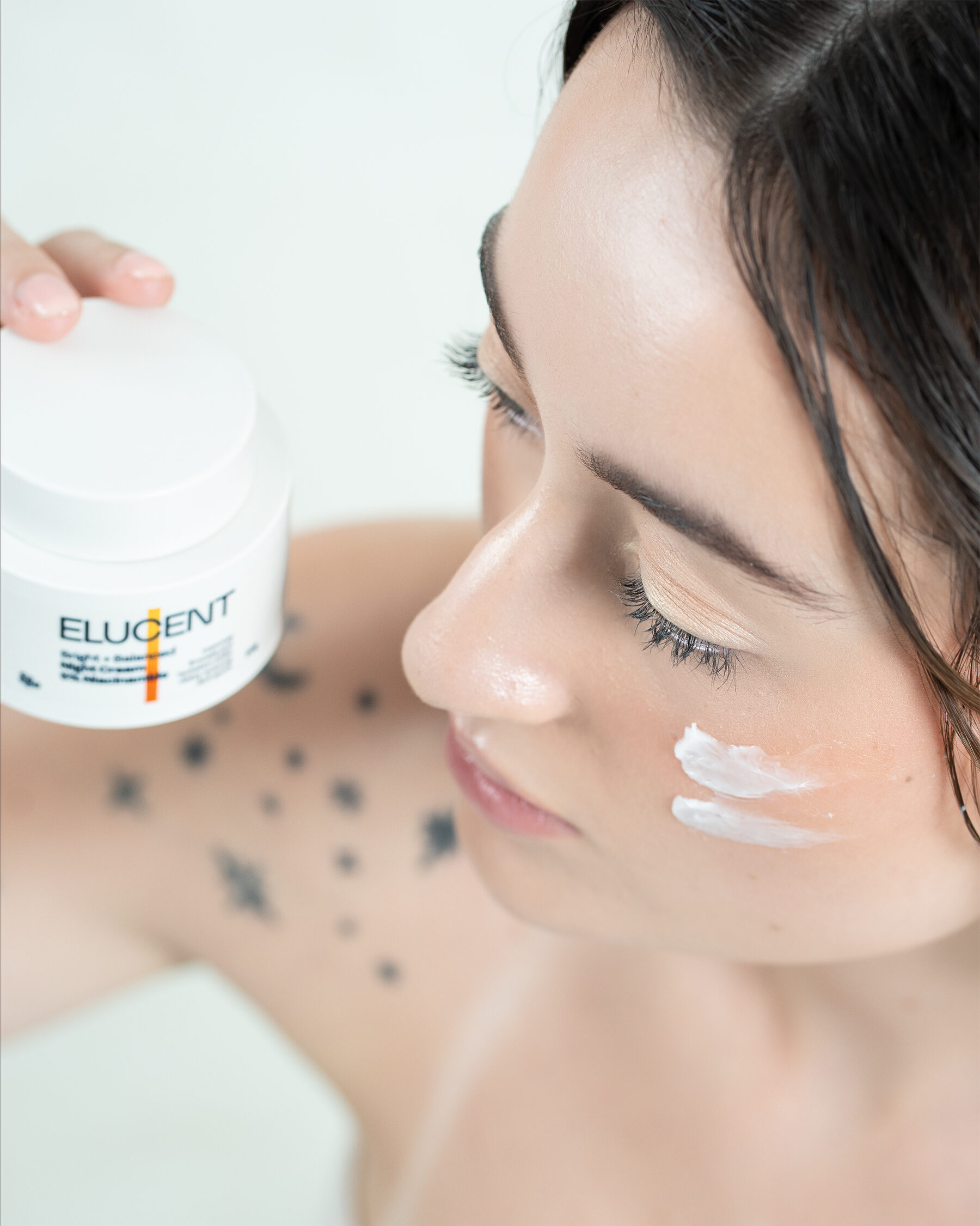 Elucent Night Cream — smiling campaign portrait