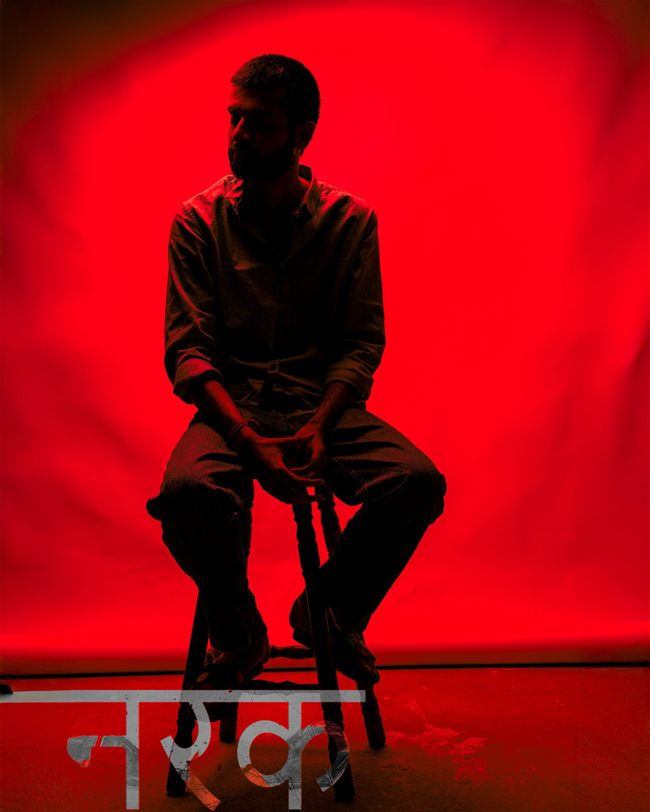 Theatrical portrait — red backdrop silhouette