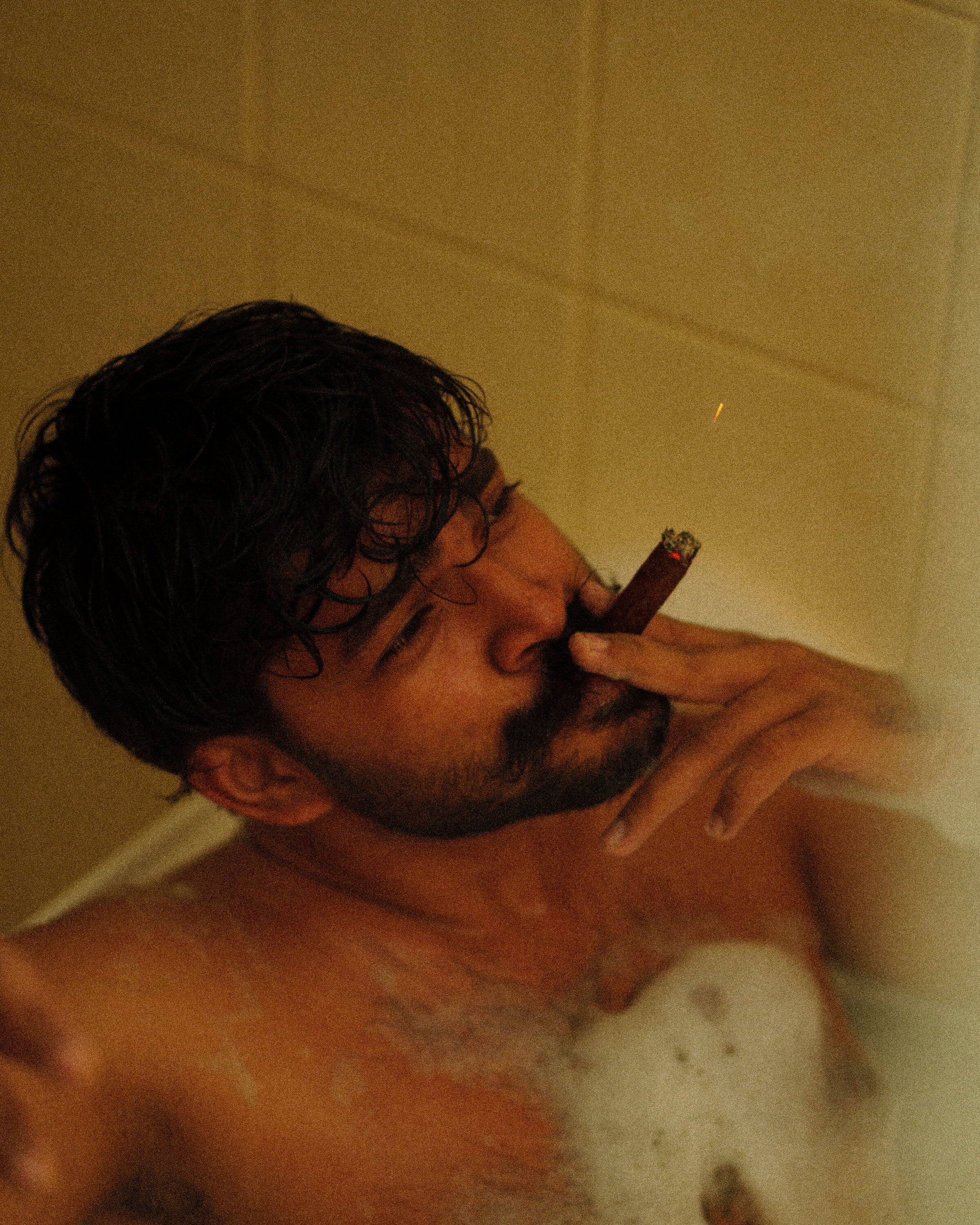 Cinematic editorial — bathtub portrait warm tones